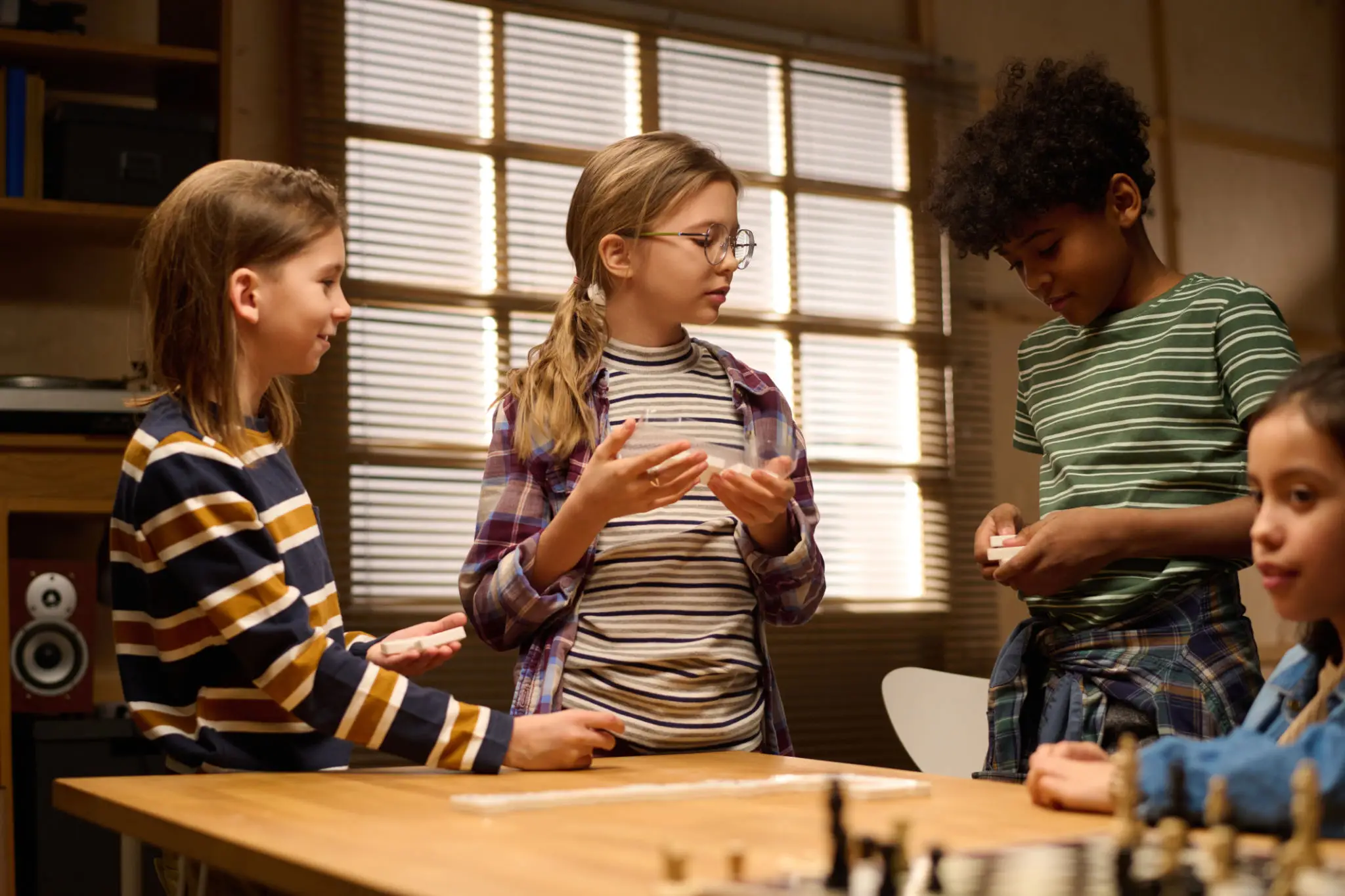 Young student wearing hearing aids engaged in a classroom activity